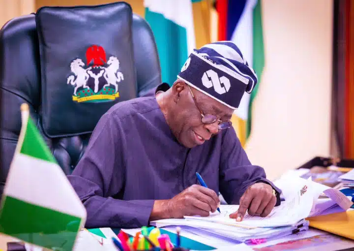 TINUBU SIGNS e1698307268999